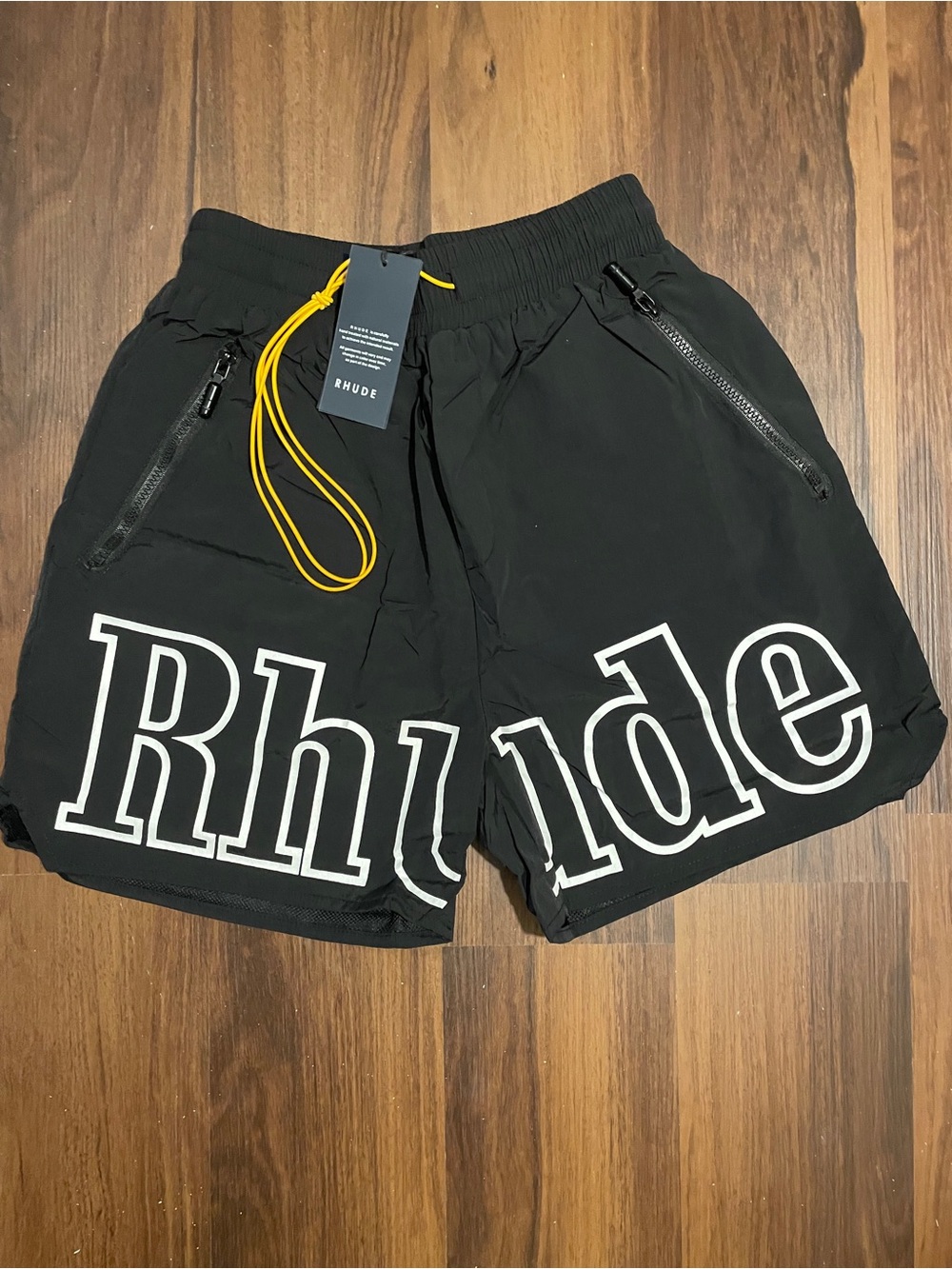 Rhude Black Athletic Shorts with White Logo and Yellow Drawcord